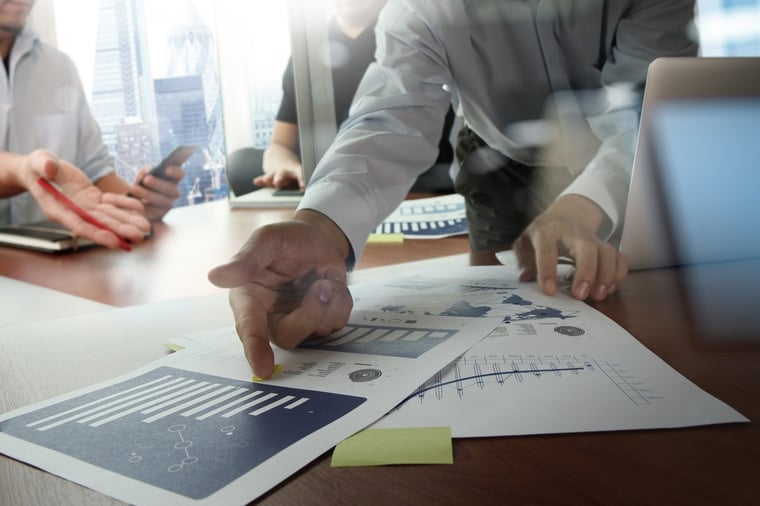 Double exposure of businessman hand working with new modern computer and business strategy as concept-1.jpeg