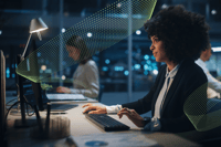 Person sits at computer screen