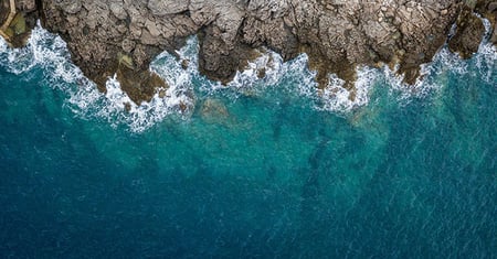 waves lapping upon rocky shore