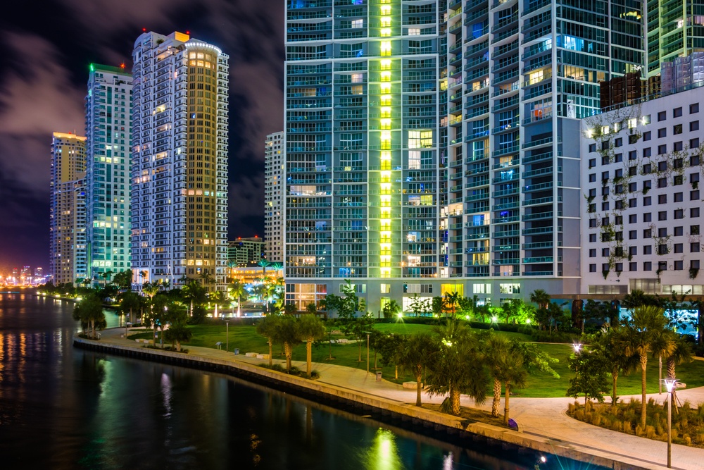 Buildings along the Miami River at night, in downtown Miami, Florida.